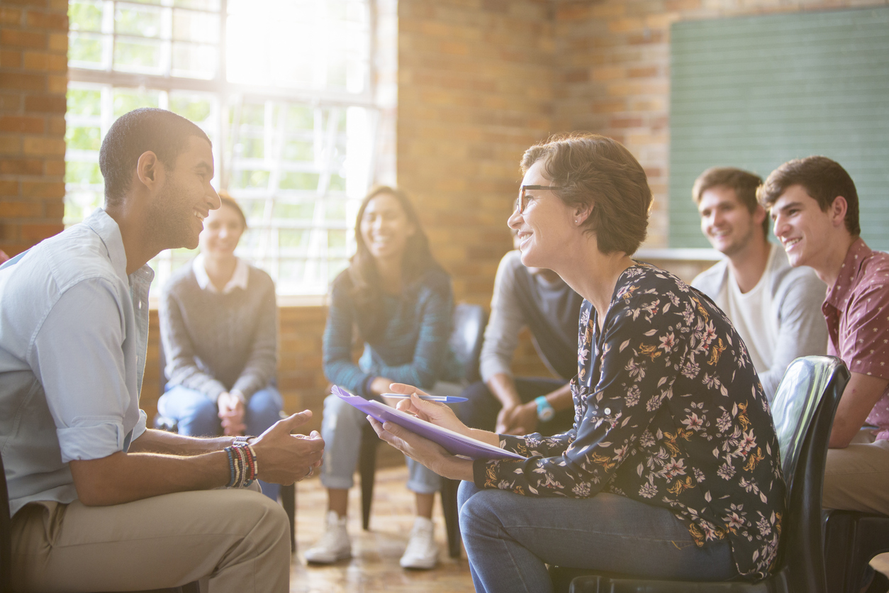 A small group of people witness a one-on-one engagement training.